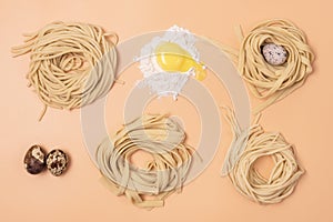 Handmade Raw Noodles Eggs and Flour on Yellow Background Horizontal Top View Italian Pasta