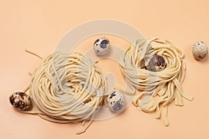 Handmade Raw Noodles and Eggs on Yellow Background Horizontal Top View Close Up Italian Pasta