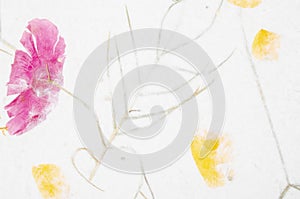 The Handmade recycled flower and leaf paper background