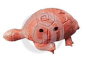 Clay Native Mesoamerican ocarina shaped like a tortoise in a white background. photo