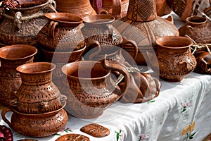 Handmade red pottery urns and pots with different painting stiles