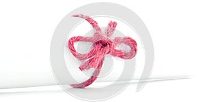 Handmade red rope knot tied on white letter package isolated