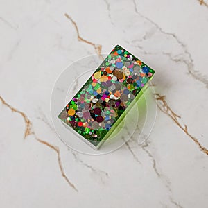 Handmade resin coaster with floral pattern on white background