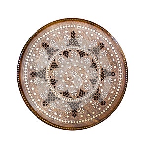 Handmade round wooden pattern. Ornamental circle floral decor panel with metal incrustation. Hadcraft vintage stool. Top view. Iso photo