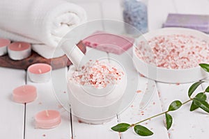 Handmade Salt Peach Scrub With Argan Oil. Himalayan Salt. Toiletries, Spa Set with candles and white towel photo