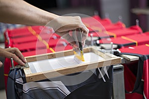 Handmade screen printing t-shirt, Workers are working