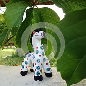 Handmade sculptur horse art russiantoy toy green garden tree nature photo