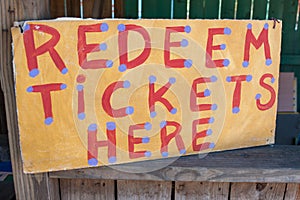 Handmade Sign Instructs Carnival Patrons Where To Redeem Tickets