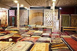 Handmade silk carpets are sold in a shop in Bukhara in Uzbekistan. 05.05.2019