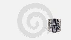 Handmade silver vintage ring with infinity symbol on white background. Magic concept.