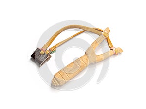 Handmade slingshot catapult. Y-shaped wooden stick with elastic tied between two top parts. Slingshot or Catapult is device for