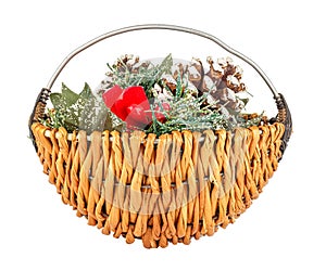 Handmade small wicker basket with decorative christmas wreath inside isolated on white background