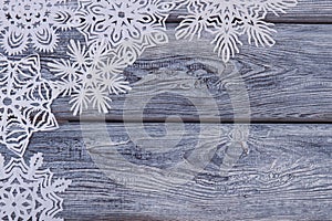 Handmade snowflakes on wooden background