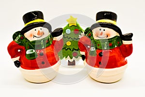 Handmade snowmen figurines isolated on white background. Christmas decoration.