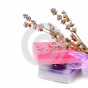 Handmade soap and dry lavender flowers isolated on white