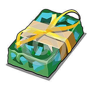 Handmade soap green with splashes of blue pieces. Cartoon gift in the military paratrooper style with yellow ribbon bow