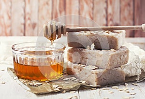 Handmade soap with honey and oatmeal. photo