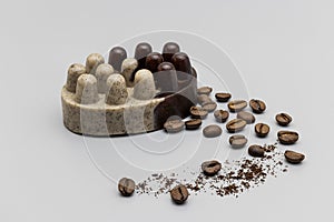 Handmade soap with natural coffee on a gray background. Natural organic home cosmetics for skin care. Skin scrub. Anti-cellulite