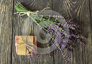 Handmade soap, near on gray surface bunch of lavender