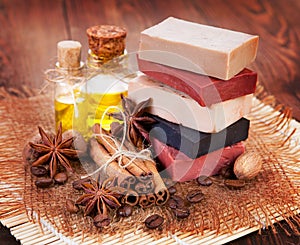 Handmade soap, oil in bottles anise and cinnamon