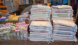 Handmade soap and Turkish bath towels, made of organic cotton, known as Hamam Pestemal on the Grand Bazaar in Istanbul, Turkey