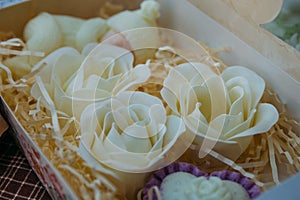 Handmade soaps in form of flowers in wooden box