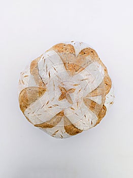 Handmade sourdough bread with symmetrical drawing