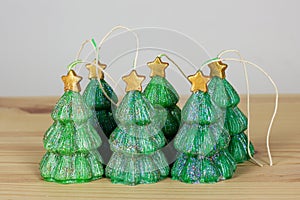 Handmade Souvenir candles in the shape of Christmas trees on a w