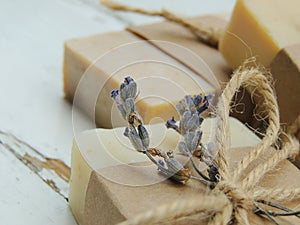 Handmade spa lavender soap on vintage wooden background. Soap making. Soap bars.