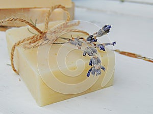 Handmade spa lavender soap on vintage wooden background. Soap making. Soap bars.