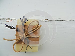 Handmade spa lavender soap on vintage wooden background. Soap making. Soap bars.