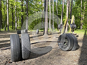 Handmade sports ground with bars made of tires in the forest