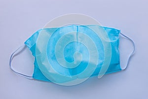 Handmade spunbond fabric sewn protective face mask against coronavirus disease COVID19 pandemic.Sewing tutorial homemade