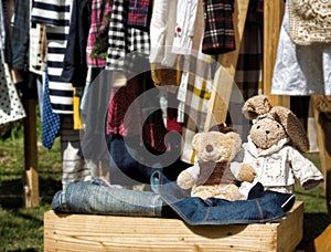 Handmade stuffed toys in wooden box at yard sale