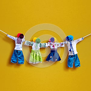 Handmade textile dolls on background, traditional ukrainian folk rag doll Motanka in ethnic style, ancient culture folk