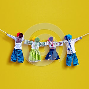 Handmade textile dolls on background, traditional ukrainian folk rag doll Motanka in ethnic style, ancient culture folk