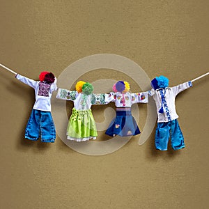 Handmade textile dolls on background, traditional ukrainian folk rag doll Motanka in ethnic style, ancient culture folk