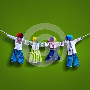 Handmade textile dolls on background, traditional ukrainian folk rag doll Motanka in ethnic style, ancient culture folk