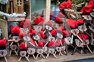 Handmade tio de nadal, a typical christmas character of catalonia, spain, on sale in a christmas market