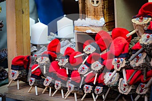 Handmade tio de nadal, a typical christmas character of catalonia, spain, on sale in a christmas market