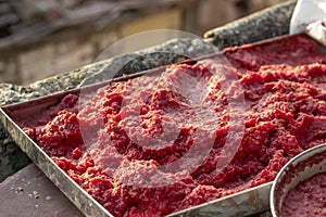 Handmade tomato paste producing process at sunset time