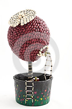 Handmade topiary tree of haricot beans isolated on white background, home decoration craftsmanship