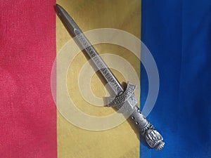 Handmade traditional Romanian objects placed on the Romanian flag and on a handmade carpet during the loom