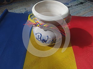 Handmade traditional Romanian objects placed on the Romanian flag and on a handmade carpet during the loom