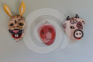 Handmade typical nicaraguan masks hanging photo