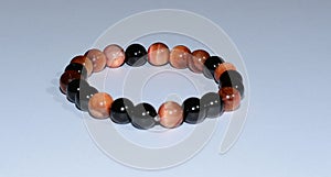 Handmade unique bracelet from tiger eye and onix mineral beads