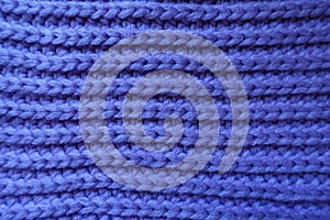 Handmade violet knitted fabric with ribbing pattern photo