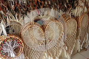Handmade white dream catcher with wooden and rattan ring. Souvenirs in a tourist shop