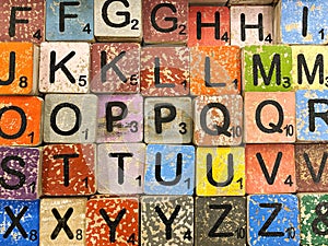 Handmade wooden alphabet blocks letters Vintage background