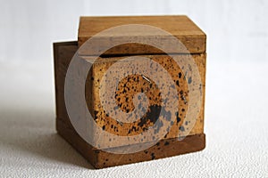 A handmade wooden box on a white background